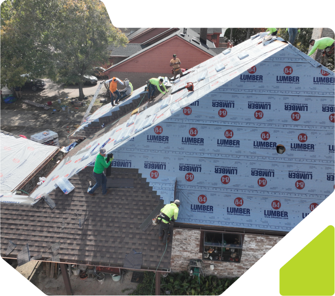 Roofers installing residential shingle roof.