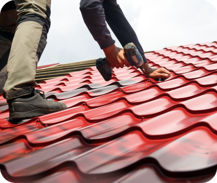 Roofer installing metal roof.